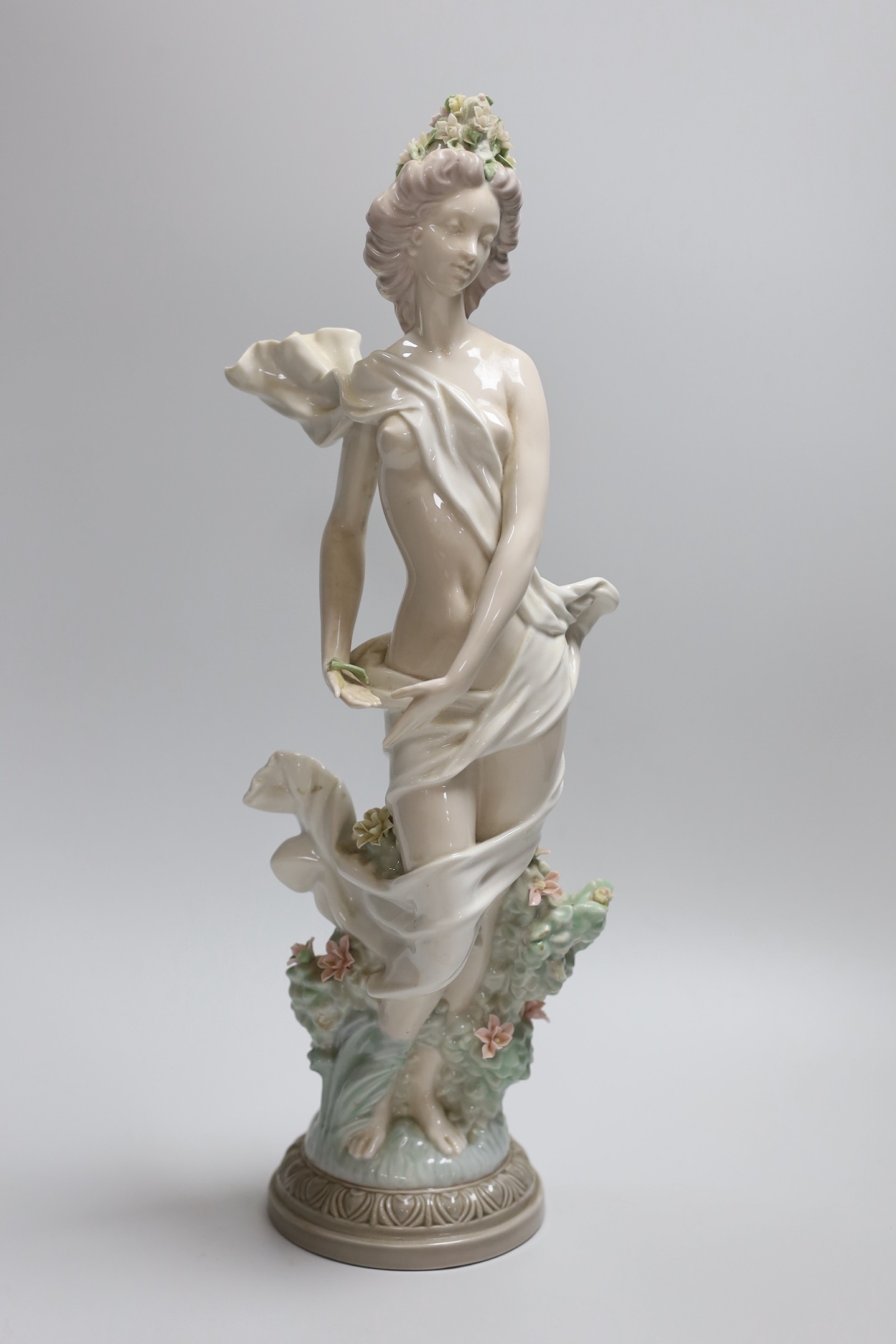 A Lladro figure of a maiden, decorators signature on base, No 401, 41cms